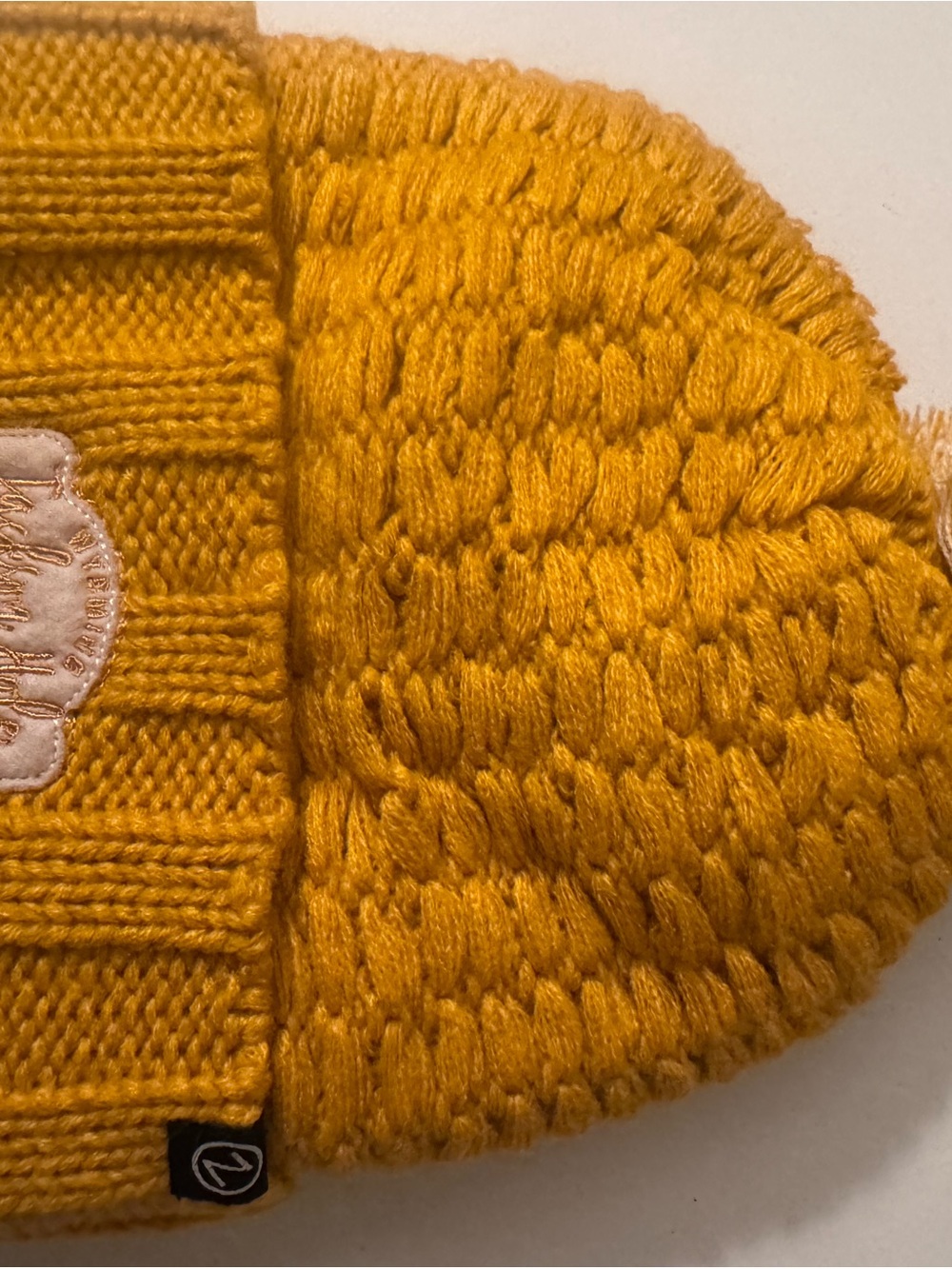 Cable Knit Beanie in Mustard Yellow with Subtle Logo